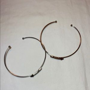 Two arrow bracelets.